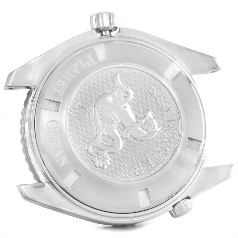 The image displays the case back of the Omega Seamaster Planet Ocean watch, including the case back crown and lugs.