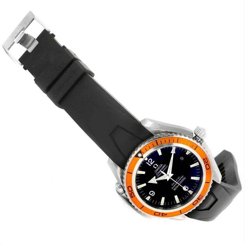 The Omega Planet Ocean 2200.50.00 Men
s Stainless Steel Black Dial 2200.50.00 Men
s Stainless Steel Black Dial watch is shown at a tilted angle, highlighting the black rubber strap, orange bezel, and black dial.