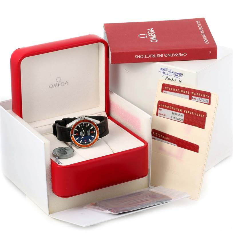 The image shows an Omega Planet Ocean 2909.50.91 Men
s Stainless Steel Black Dial 2909.50.91 Men
s Stainless Steel Black Dial watch in an open box, along with warranty cards, a booklet, and a packaging box.