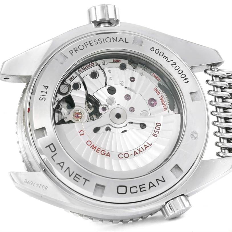 The image shows the back view of the Omega Planet Ocean 232.30.46.21.01.003 Men
s Stainless Steel Black Dial 232.30.46.21.01.003 Men
s Stainless Steel Black Dial watch, highlighting the movement and internal mechanics.