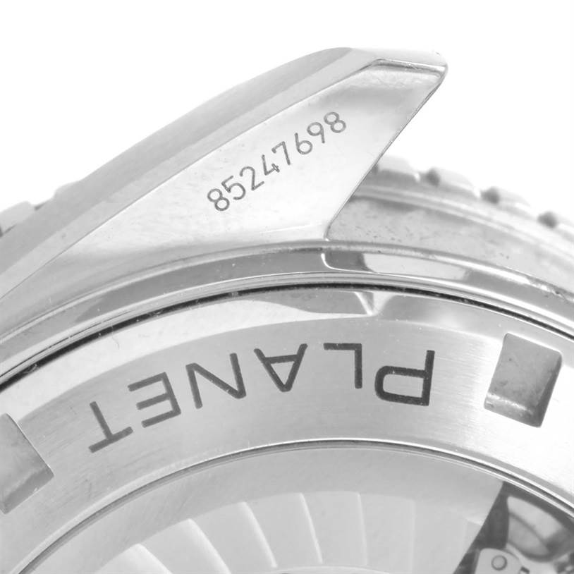 The image shows a close-up of the bezel and part of the case back of an Omega Planet Ocean 232.30.46.21.01.003 Men
s Stainless Steel Black Dial 232.30.46.21.01.003 Men
s Stainless Steel Black Dial watch, highlighting a serial number and "PLANET" text.