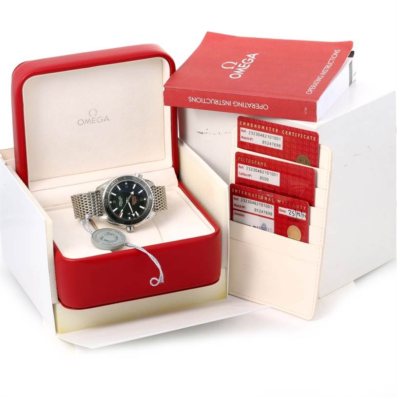 The Omega Planet Ocean 232.30.46.21.01.003 Men
s Stainless Steel Black Dial 232.30.46.21.01.003 Men
s Stainless Steel Black Dial watch is displayed in its open red case with an instruction manual and certification cards.