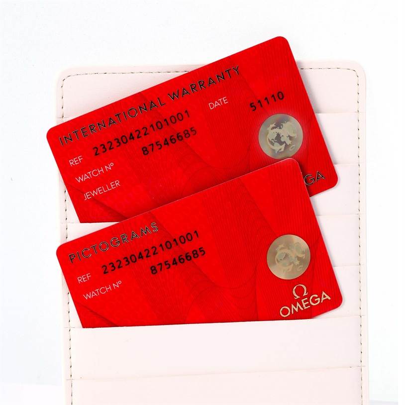 The image shows International Warranty and Pictograms cards for an Omega Planet Ocean 232.30.42.21.01.001 Men
s Stainless Steel Black Dial 232.30.42.21.01.001 Men
s Stainless Steel Black Dial watch placed in a cardholder.