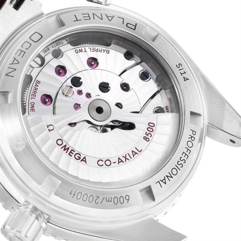 The image shows the back view of the Omega Planet Ocean 232.30.42.21.01.001 Men
s Stainless Steel Black Dial 232.30.42.21.01.001 Men
s Stainless Steel Black Dial watch, highlighting its co-axial 8500 movement mechanism.