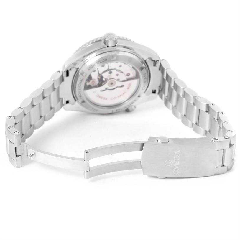 The image shows the back and bracelet clasp of the Omega Planet Ocean 232.30.42.21.01.001 Men
s Stainless Steel Black Dial 232.30.42.21.01.001 Men
s Stainless Steel Black Dial watch at an angle, highlighting the movement and case back.