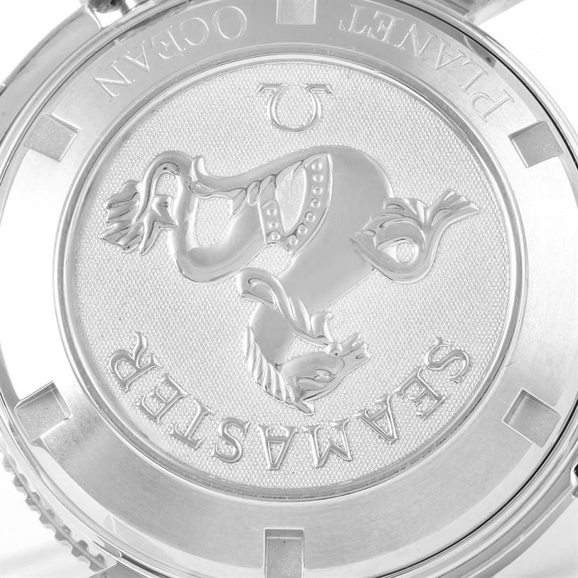 The image shows the back case of an Omega Planet Ocean 2209.50.00 Men
s Stainless Steel Black Dial 2209.50.00 Men
s Stainless Steel Black Dial Seamaster watch, featuring an engraved seahorse design.
