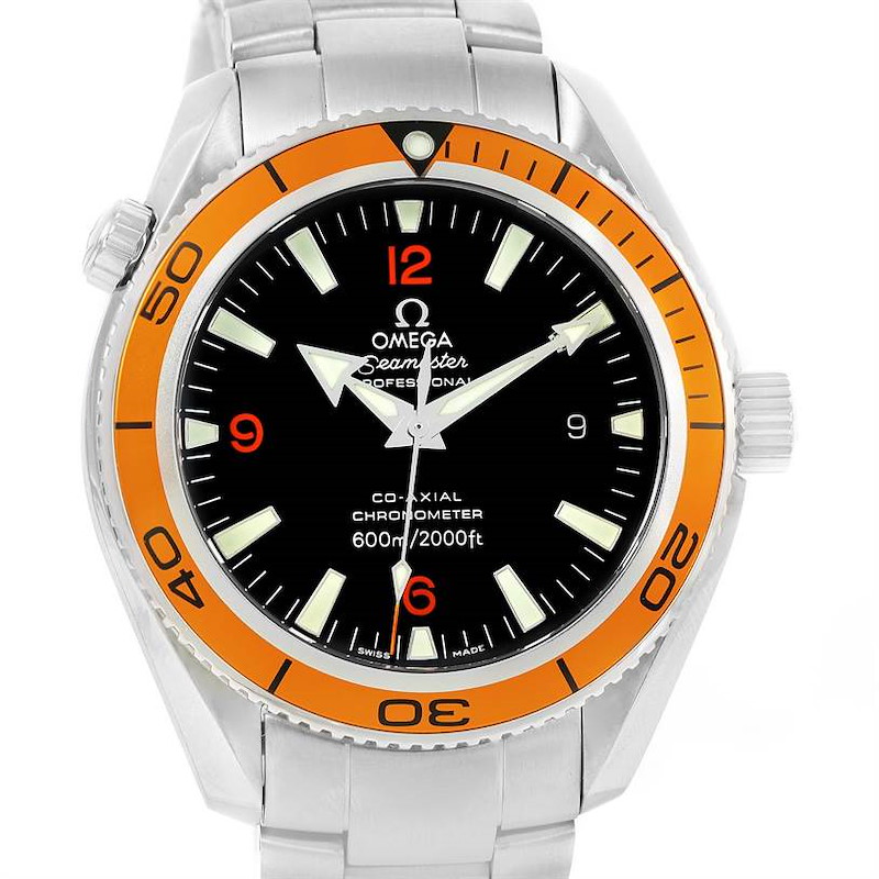 The image shows a front view of the Omega Planet Ocean model, highlighting its dial, bezel, case, and part of the bracelet.