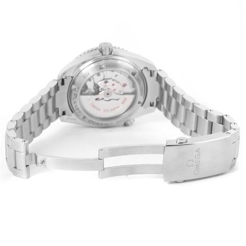 The image shows the Omega Planet Ocean 232.30.42.21.01.001 Men
s Stainless Steel Black Dial 232.30.42.21.01.001 Men
s Stainless Steel Black Dial watch from the back, highlighting its open case back and partially open bracelet clasp.