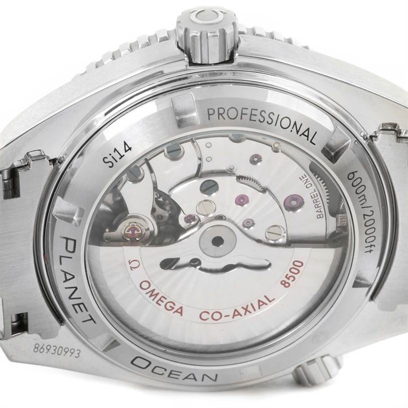 The image shows the back of the Omega Planet Ocean 232.30.42.21.01.001 Men
s Stainless Steel Black Dial 232.30.42.21.01.001 Men
s Stainless Steel Black Dial watch, highlighting its internal mechanism and engravings.