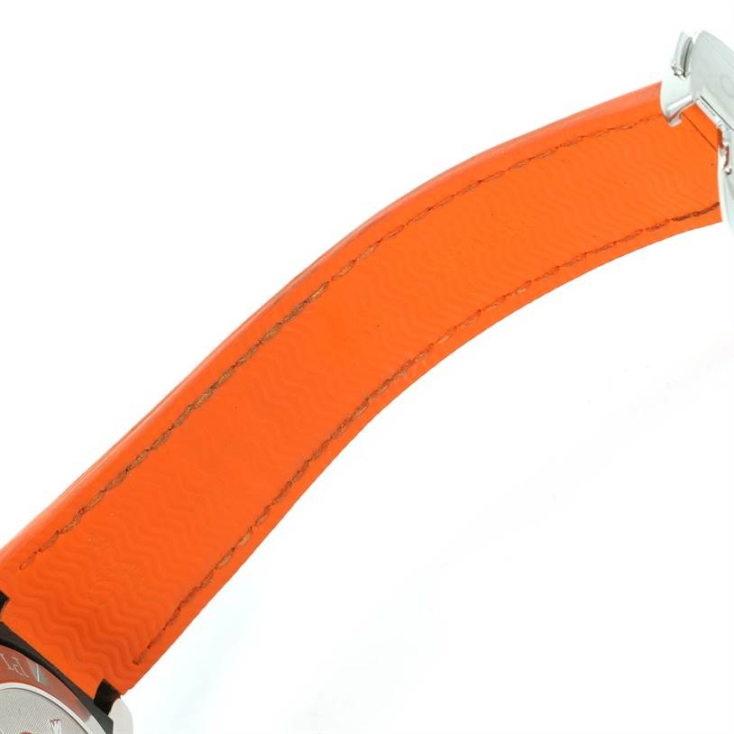 The image shows a close-up side view of an orange leather strap of an Omega Planet Ocean 2918.50.38 Men
s Stainless Steel Black Dial 2918.50.38 Men
s Stainless Steel Black Dial watch.