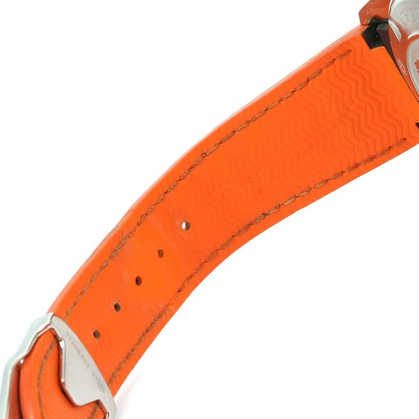 The image shows a close-up of the orange strap of the Omega Planet Ocean 2918.50.38 Men
s Stainless Steel Black Dial 2918.50.38 Men
s Stainless Steel Black Dial watch, focusing on the stitching and buckle holes.