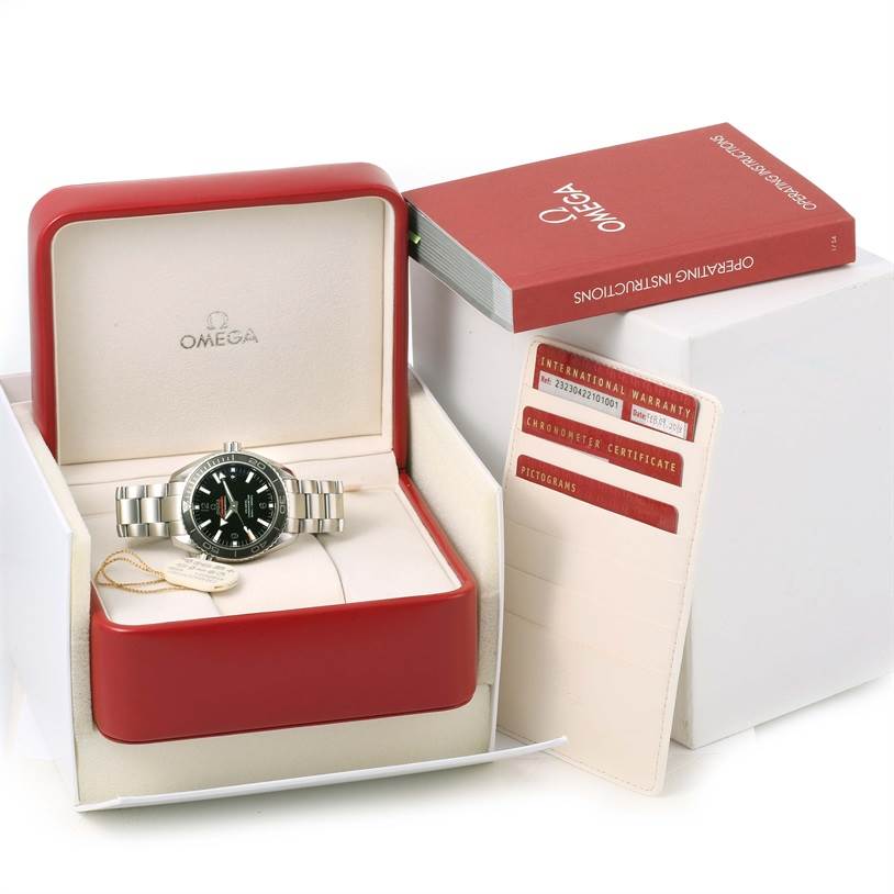 The Omega Planet Ocean 232.30.42.21.01.003 Men
s Stainless Steel Black Dial 232.30.42.21.01.003 Men
s Stainless Steel Black Dial watch is shown from a front angle in its box, along with the instruction manual and warranty cards.