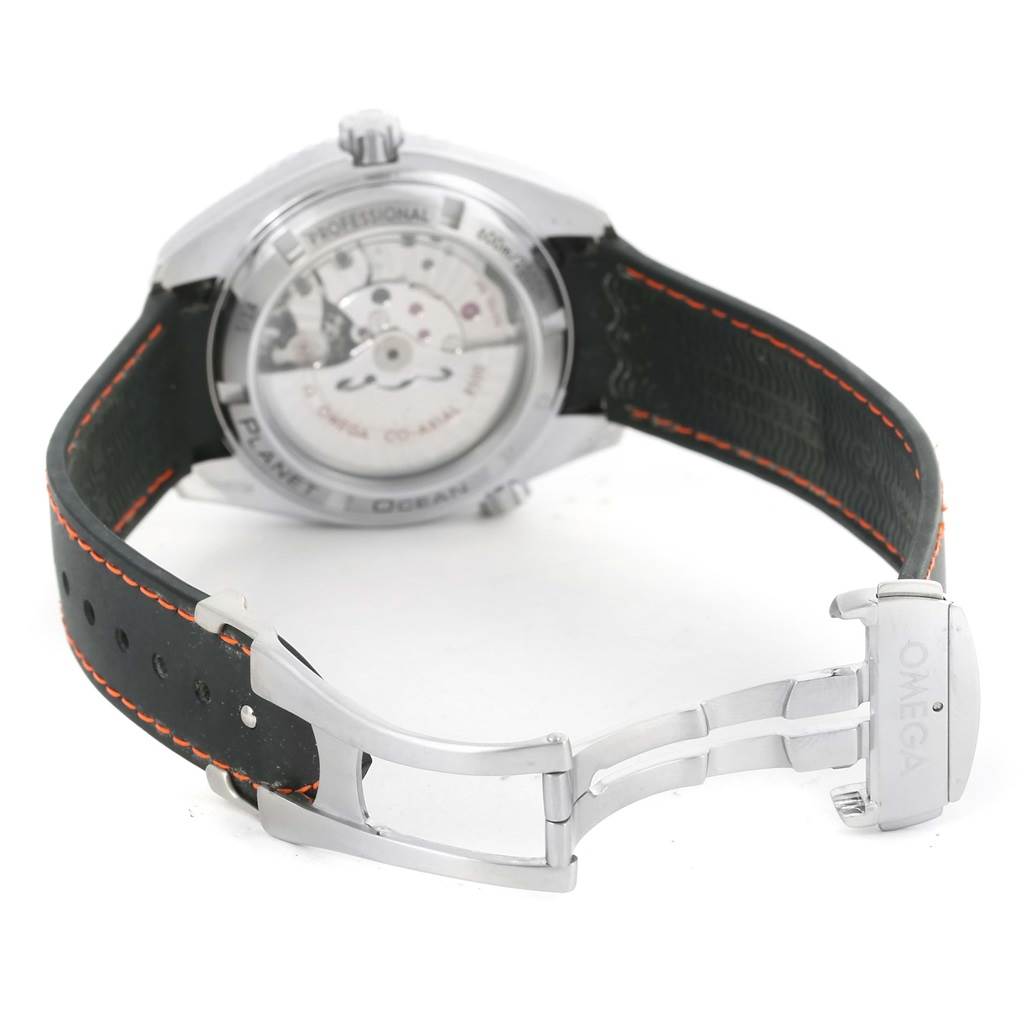 The image shows the back and clasp of the Omega Planet Ocean 232.30.42.21.01.003 Men
s Stainless Steel Black Dial 232.30.42.21.01.003 Men
s Stainless Steel Black Dial watch, highlighting its black strap with orange stitching and visible movement.