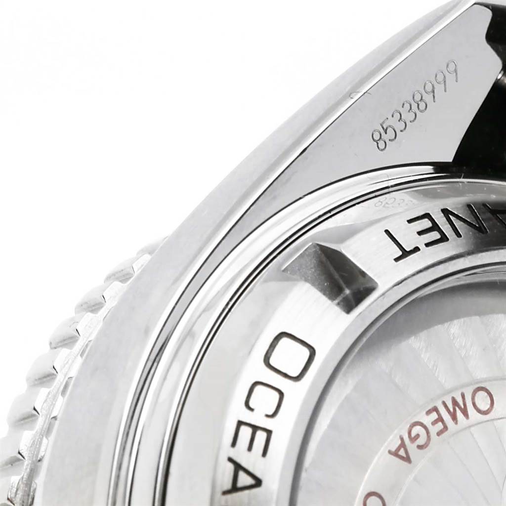 The image shows a close-up of the case back of the Omega Planet Ocean 232.30.42.21.01.003 Men
s Stainless Steel Black Dial 232.30.42.21.01.003 Men
s Stainless Steel Black Dial watch, highlighting the branding and serial number.