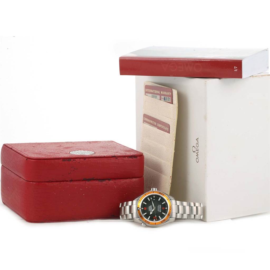 The image shows an Omega Planet Ocean 2209.50.00 Men
s Stainless Steel Black Dial 2209.50.00 Men
s Stainless Steel Black Dial watch, its red case, packaging, and accompanying documents, displayed from a front angle.