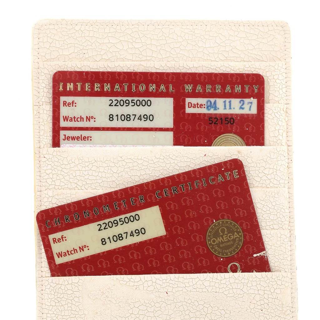 The image shows the International Warranty and Chronometer Certificate cards for the Omega Planet Ocean 2209.50.00 Men
s Stainless Steel Black Dial 2209.50.00 Men
s Stainless Steel Black Dial model.