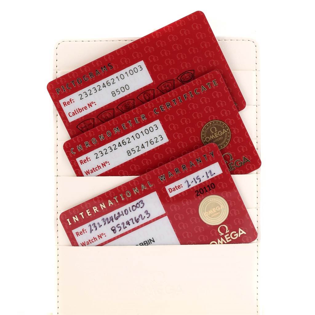 The image shows the warranty, chronometer certificate, and pictograms cards for the Omega Planet Ocean 232.32.46.21.01.003 Men
s Stainless Steel Black Dial 232.32.46.21.01.003 Men
s Stainless Steel Black Dial watch.