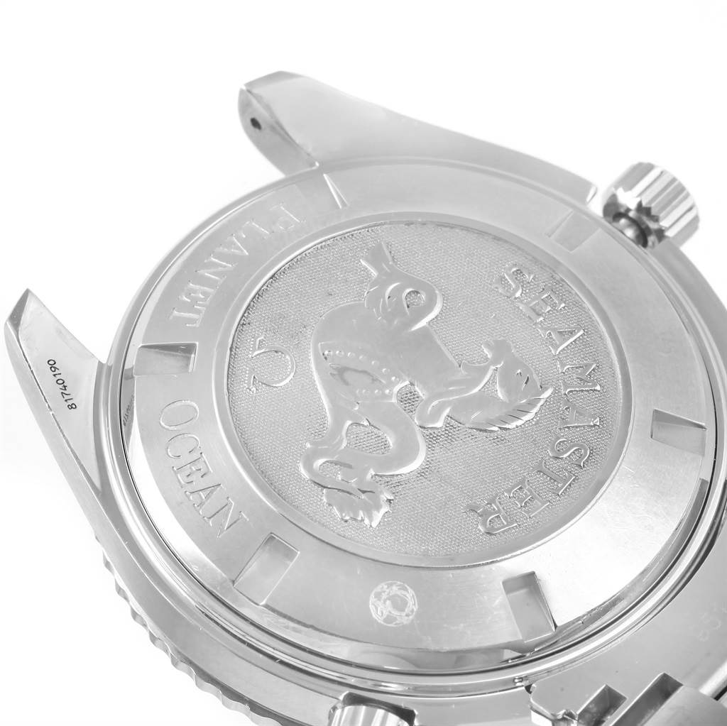 This image shows the back case of the Omega Planet Ocean 2208.50.00 Men
s Stainless Steel Black Dial 2208.50.00 Men
s Stainless Steel Black Dial watch, featuring the engraved logo and crown mechanism.