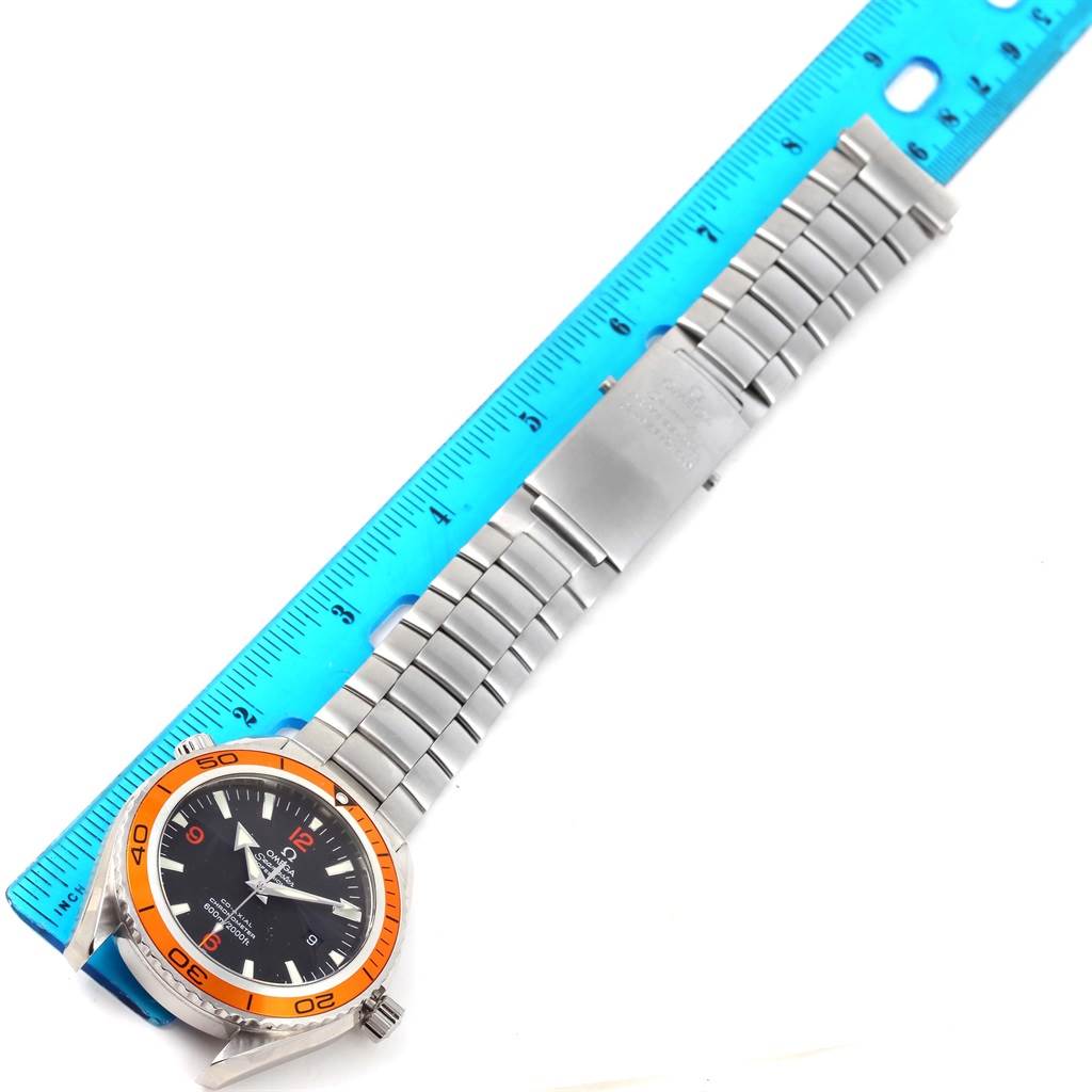 The Omega Planet Ocean 2208.50.00 Men
s Stainless Steel Black Dial 2208.50.00 Men
s Stainless Steel Black Dial watch is shown from a top-down angle, highlighting the stainless steel bracelet and orange bezel.