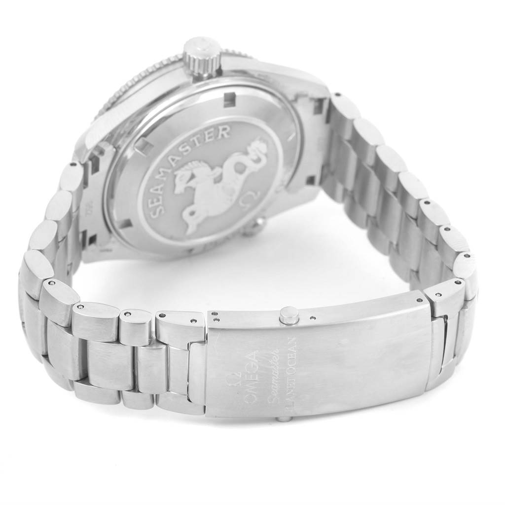 The image shows the back case and bracelet clasp of an Omega Seamaster Planet Ocean watch at an angled view.