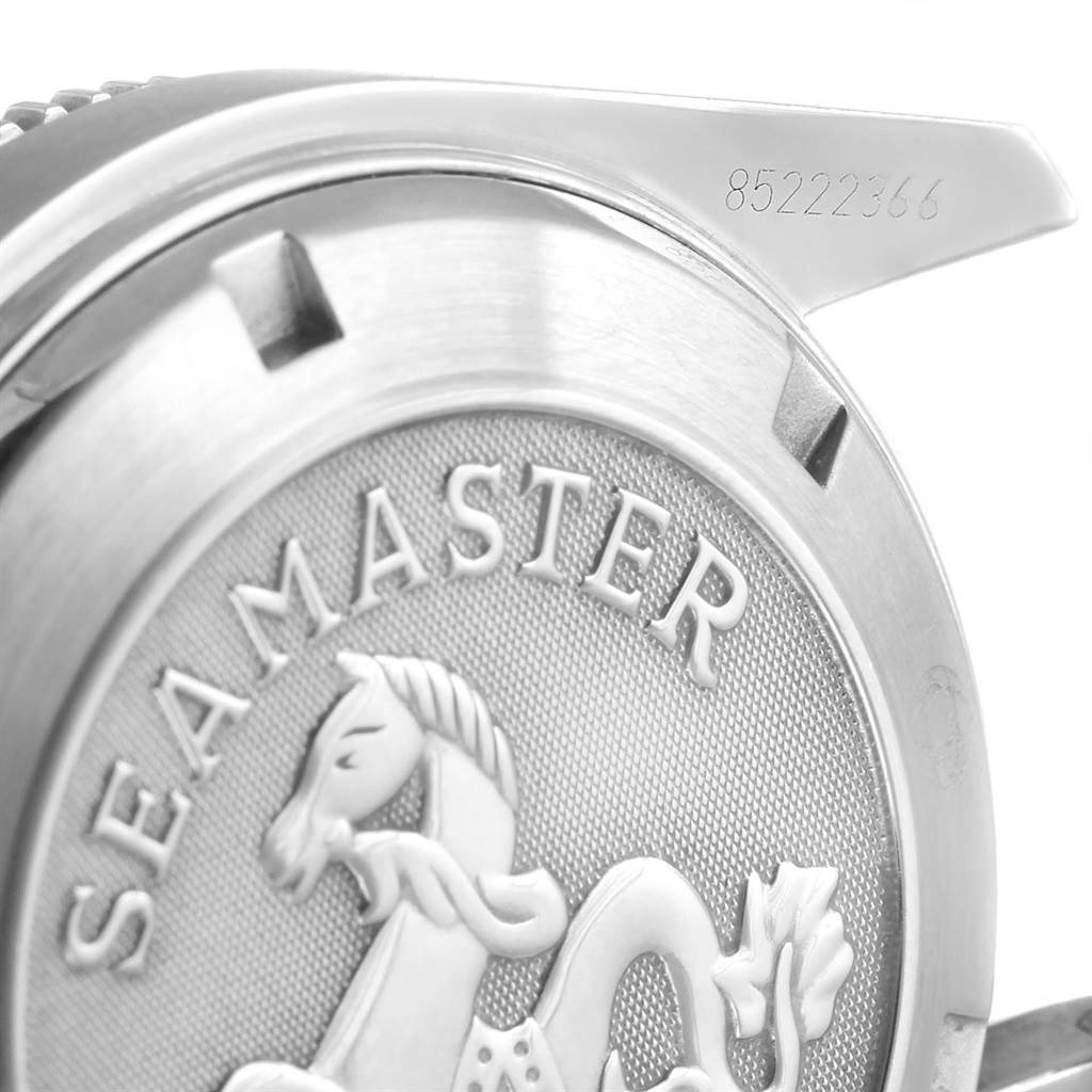 The image shows a close-up view of the case back and part of the lug of an Omega Planet Ocean 2209.50.00 Men
s Stainless Steel Black Dial 2209.50.00 Men
s Stainless Steel Black Dial watch, revealing the "Seamaster" engraving and serial number.