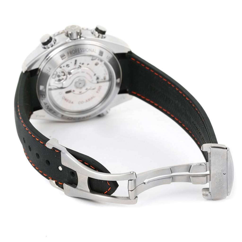 The image shows the back case and deployment clasp of the Omega Planet Ocean 232.32.46.51.01.005 Men
s Stainless Steel Black Dial 232.32.46.51.01.005 Men
s Stainless Steel Black Dial watch, highlighting the movement and strap stitching.