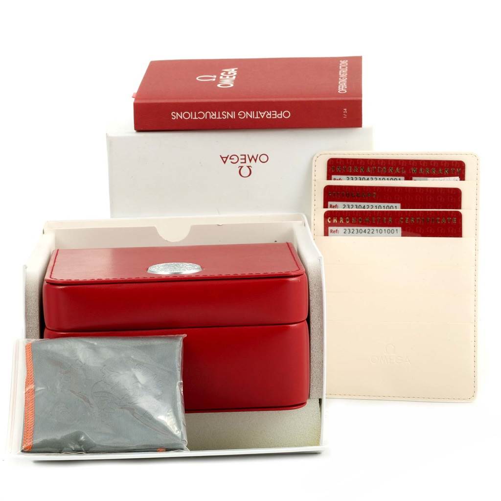 This image shows the accessories for an Omega Planet Ocean 232.30.42.21.01.003 Men's Stainless Steel Black Dial 232.30.42.21.01.003 Men's Stainless Steel Black Dial watch, including a red box, operating instructions, and warranty cards.