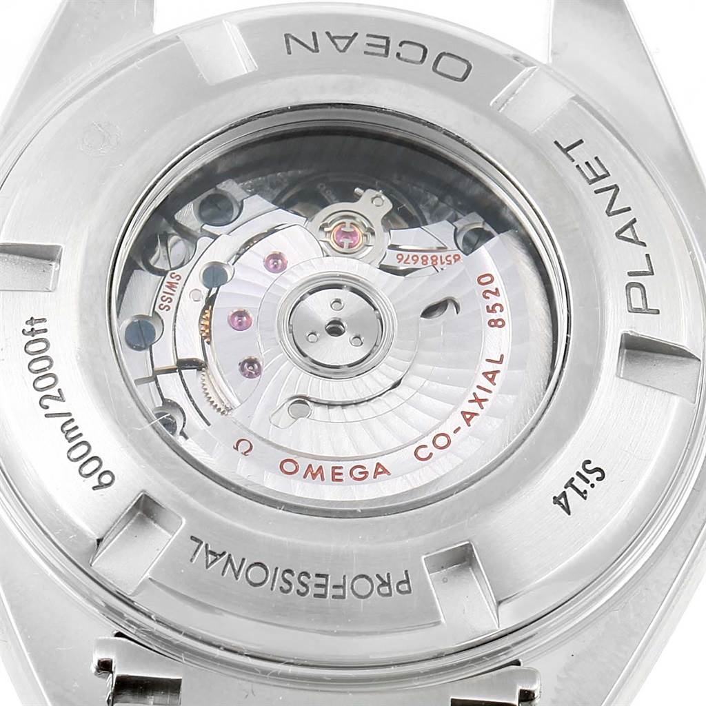 The image shows the back of an Omega Planet Ocean 232.30.38.20.01.002 Men
s Stainless Steel Black Dial 232.30.38.20.01.002 Men
s Stainless Steel Black Dial watch, highlighting the movement and the inscriptions.