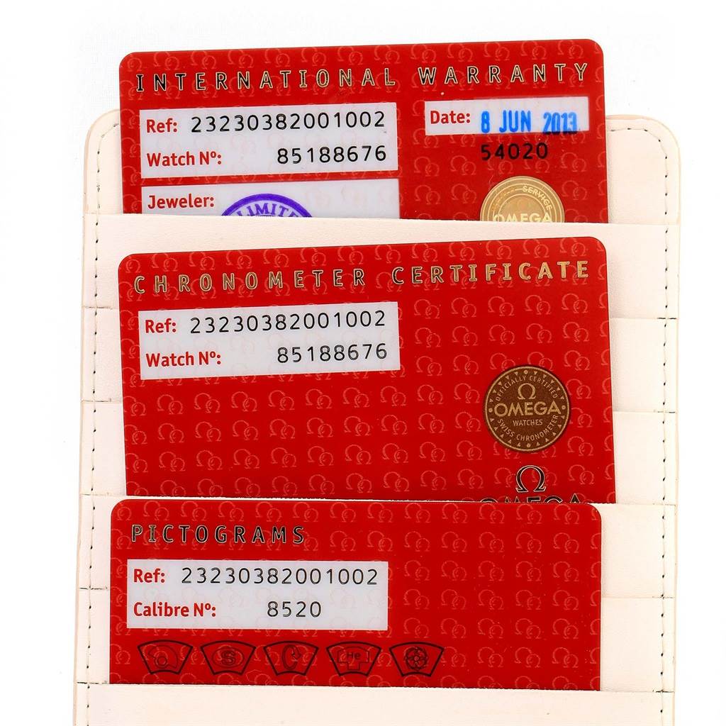 The image shows International Warranty, Chronometer Certificate, and Pictograms cards for the Omega Planet Ocean 232.30.38.20.01.002 Men
s Stainless Steel Black Dial 232.30.38.20.01.002 Men
s Stainless Steel Black Dial model watch.