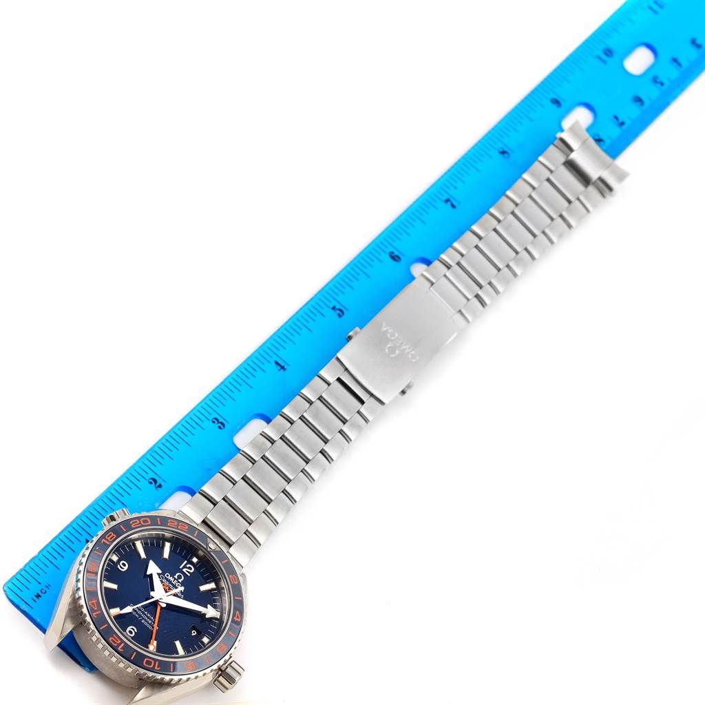 The Omega Planet Ocean 232.30.44.22.03.001 Men's Stainless Steel Blue Dial 232.30.44.22.03.001 Men's Stainless Steel Blue Dial watch is shown from an overhead angle, highlighting the face, bezel, and metal bracelet with a clasp.