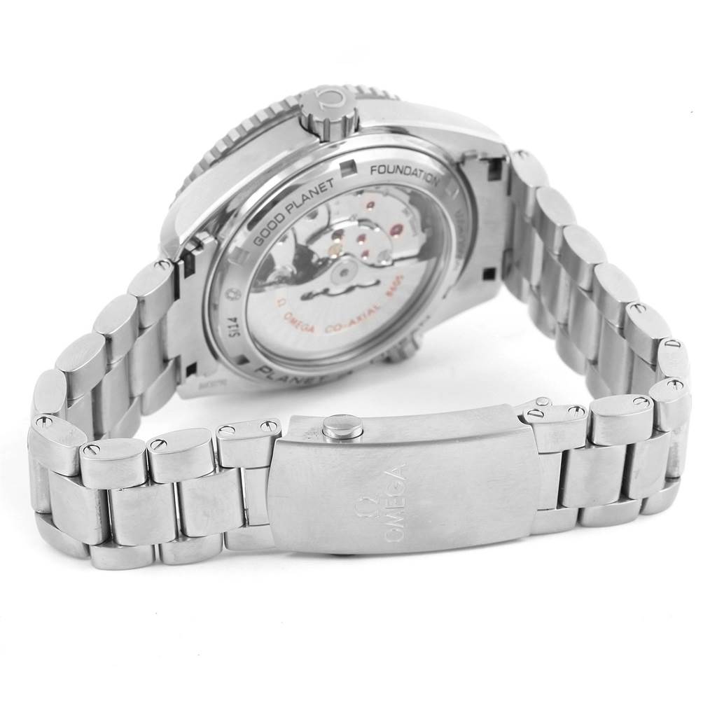 The image shows the back view of the Omega Planet Ocean 232.30.44.22.03.001 Men's Stainless Steel Blue Dial 232.30.44.22.03.001 Men's Stainless Steel Blue Dial watch, highlighting its metal bracelet and transparent case back.