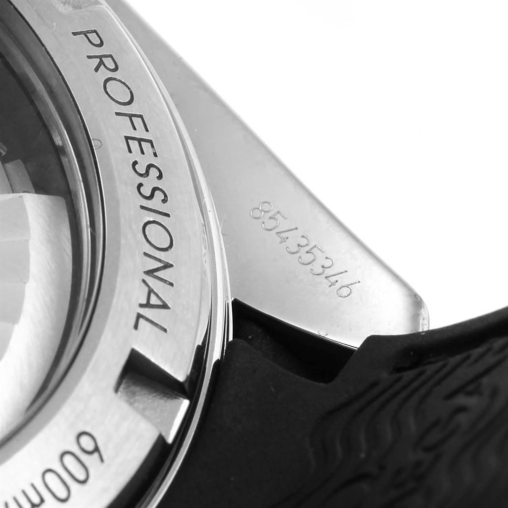 The image shows a close-up of the back of an Omega Planet Ocean 232.32.46.21.01.003 Men
s Stainless Steel Black Dial 232.32.46.21.01.003 Men
s Stainless Steel Black Dial watch with "PROFESSIONAL" and serial number visible.