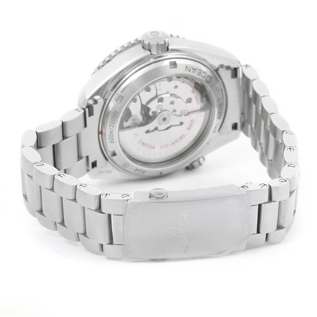 The image shows the back view of the Omega Planet Ocean 232.30.44.22.01.002 Men
s Stainless Steel Black Dial 232.30.44.22.01.002 Men
s Stainless Steel Black Dial watch, highlighting its transparent case back and stainless steel bracelet.