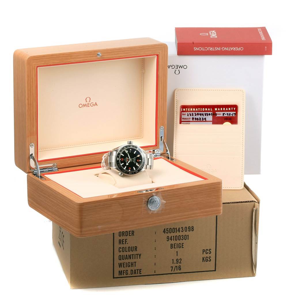 The Omega Planet Ocean 232.30.44.22.01.002 Men
s Stainless Steel Black Dial 232.30.44.22.01.002 Men
s Stainless Steel Black Dial watch is shown inside its open box, with warranty cards and instructions visible.