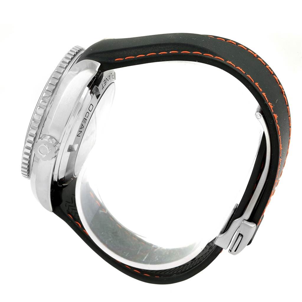 The image shows a side profile of an Omega Planet Ocean 232.32.42.21.01.005 Men
s Stainless Steel Black Dial 232.32.42.21.01.005 Men
s Stainless Steel Black Dial watch, highlighting the crown, bezel, and black strap with orange stitching.