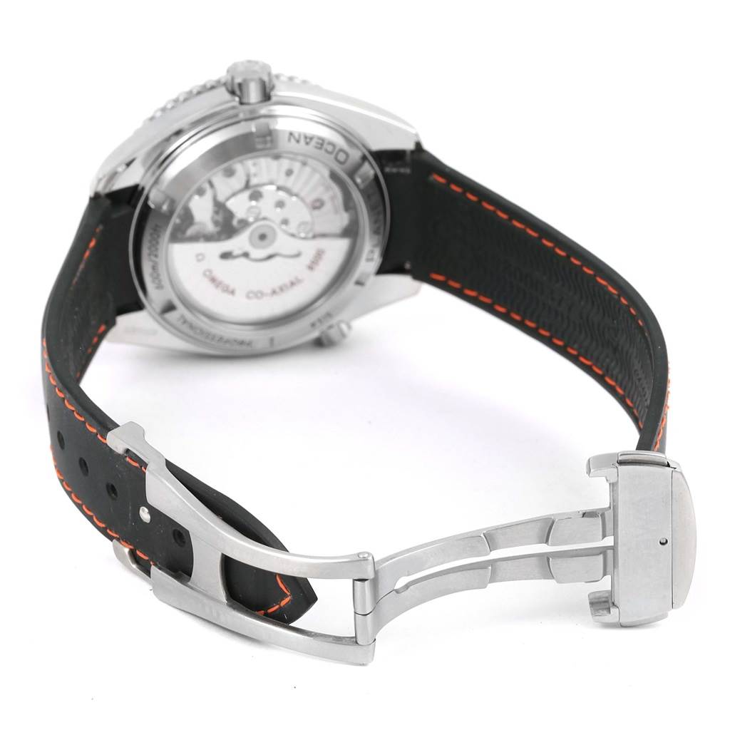 The image shows the backside of the Omega Planet Ocean 232.32.42.21.01.005 Men
s Stainless Steel Black Dial 232.32.42.21.01.005 Men
s Stainless Steel Black Dial watch, displaying its exposed movement and strap with a steel deployment clasp.