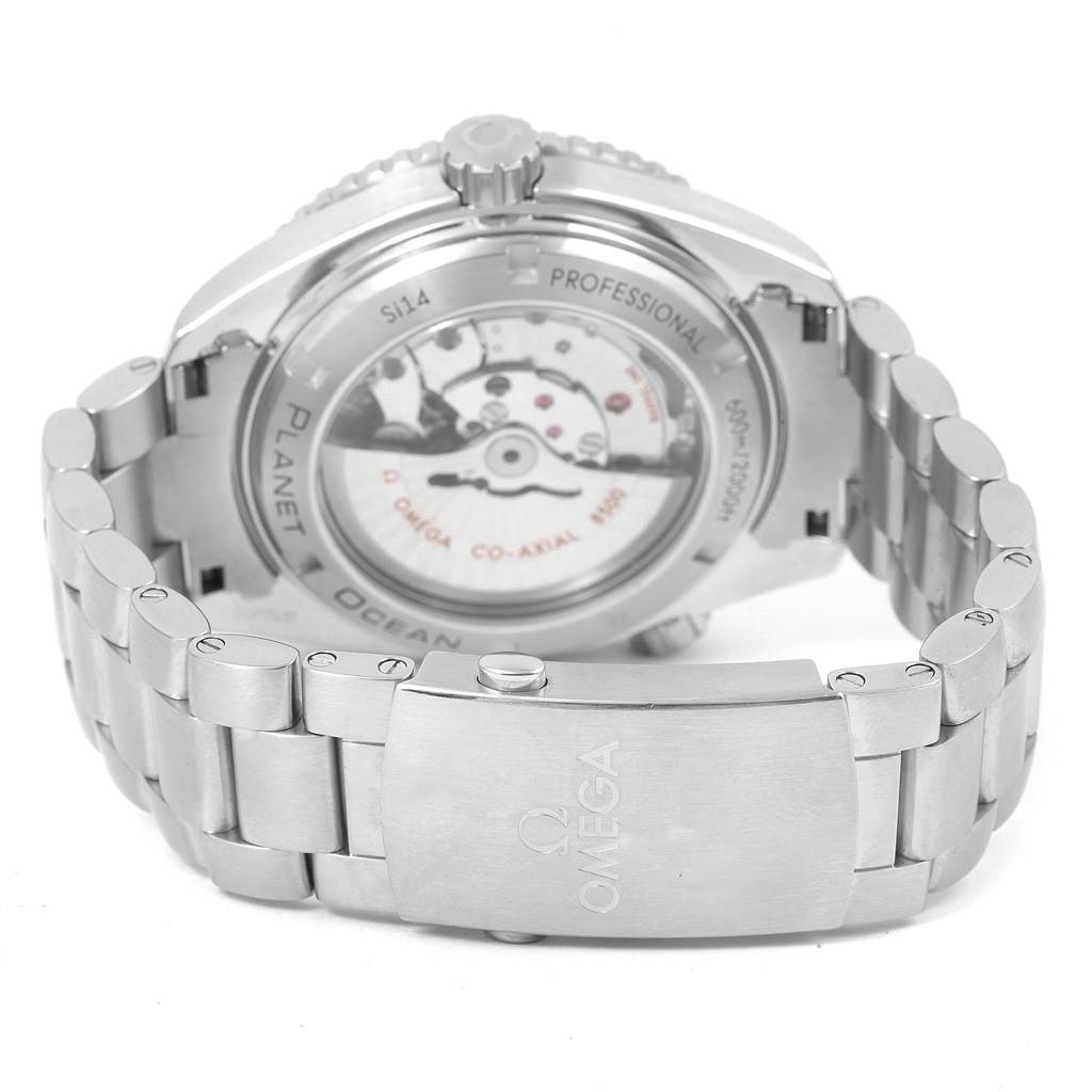 The image shows the rear view and clasp of an Omega Planet Ocean 232.30.46.21.01.001 Men
s Stainless Steel Black Dial 232.30.46.21.01.001 Men
s Stainless Steel Black Dial watch, highlighting the transparent case back and metal bracelet.