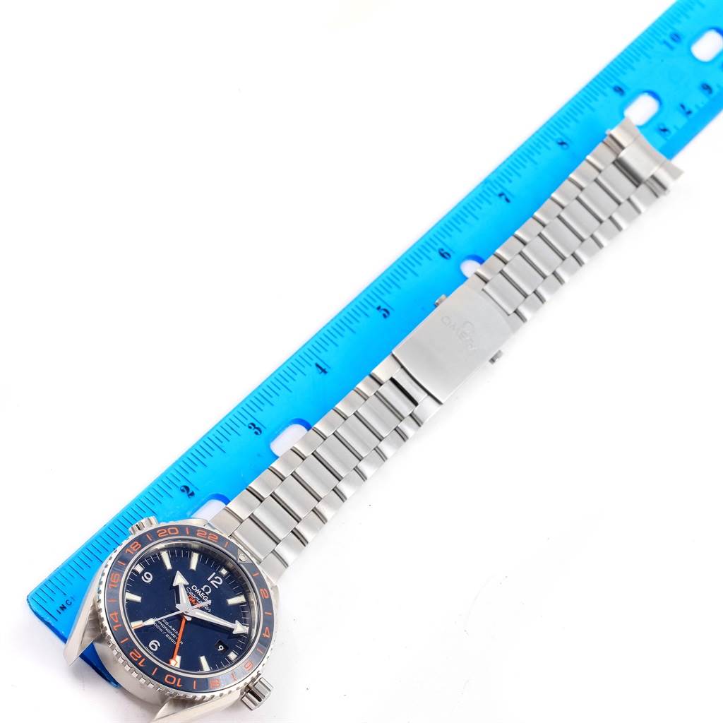 The Omega Planet Ocean 232.30.44.22.03.001 Men
s Stainless Steel Blue Dial 232.30.44.22.03.001 Men
s Stainless Steel Blue Dial watch is shown from a top-down angle, including the face and the entire metal strap.