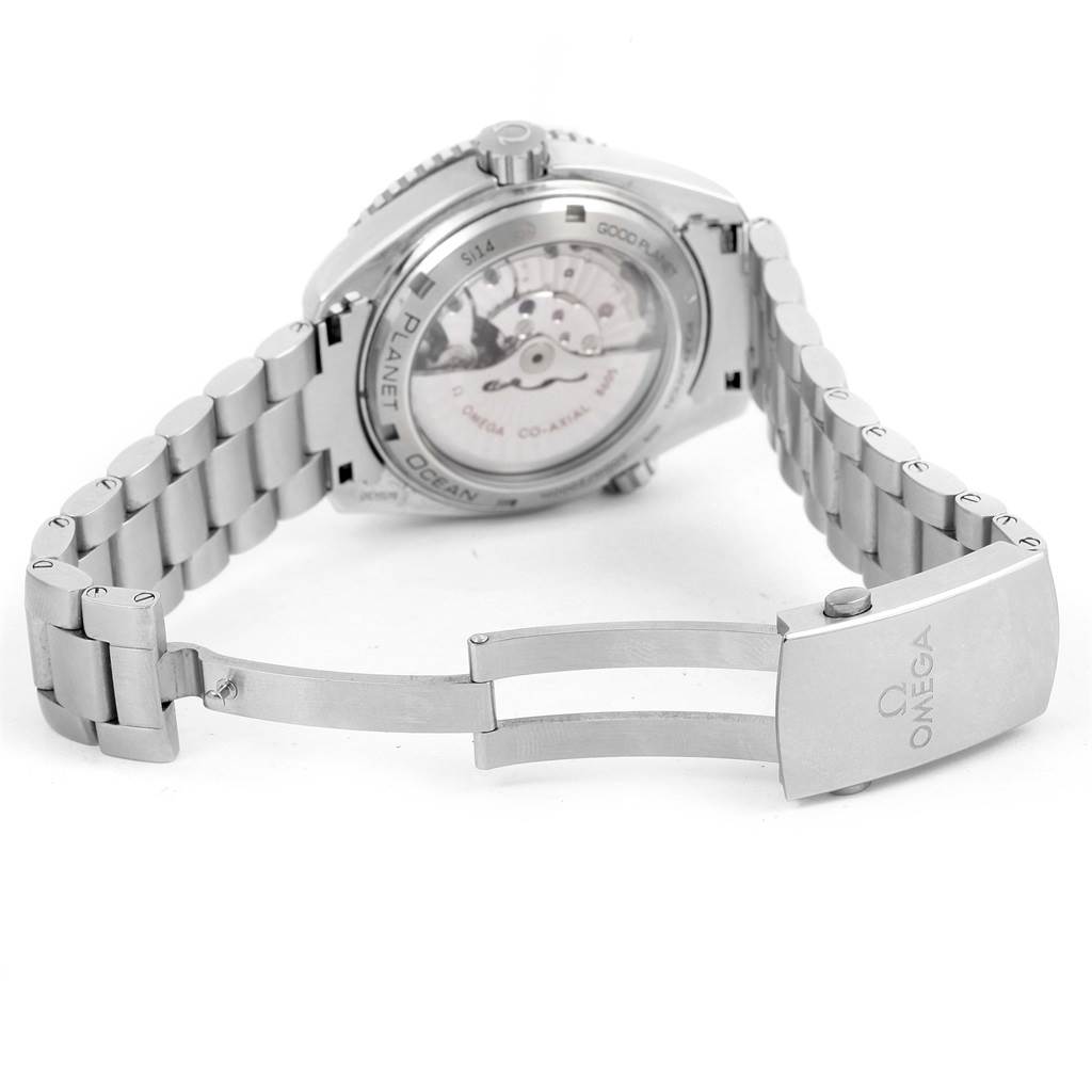 The image shows the back and bracelet of the Omega Planet Ocean 232.30.44.22.03.001 Men
s Stainless Steel Blue Dial 232.30.44.22.03.001 Men
s Stainless Steel Blue Dial watch, highlighting the open clasp and transparent case back.