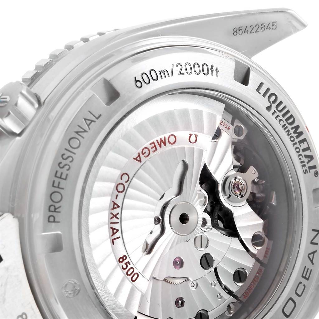 The image shows the back view of the Omega Planet Ocean 232.90.46.21.03.001 Men's Titanium Blue Dial 232.90.46.21.03.001 Men's Titanium Blue Dial watch, focusing on the movement mechanism and engravings.