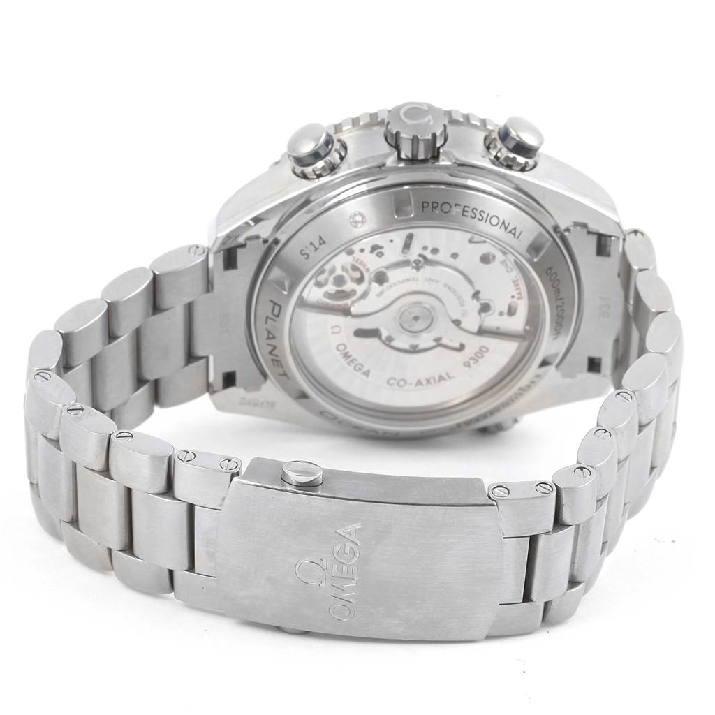 The image shows the rear angle of an Omega Planet Ocean 232.90.46.51.03.001 Men's Titanium Blue Dial 232.90.46.51.03.001 Men's Titanium Blue Dial watch, showcasing its open case back, bracelet, and clasp.