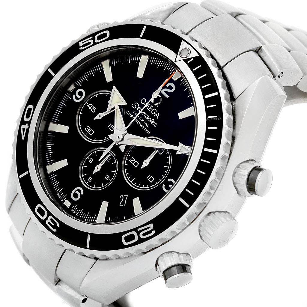 The image shows the Omega Planet Ocean 2210.50.00 Men's Stainless Steel Black Dial 2210.50.00 Men's Stainless Steel Black Dial watch face and side profile, highlighting the bezel, chronograph sub-dials, and crown.