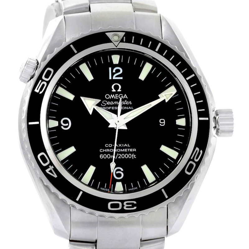 The Omega Planet Ocean watch is shown from the front, displaying its face, bezel, crown, and part of the metal bracelet.