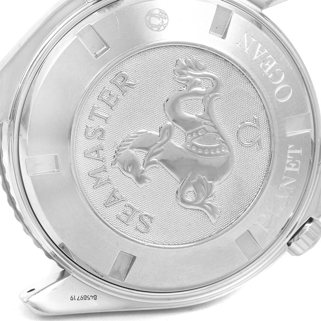 The image shows the case back of an Omega Seamaster Planet Ocean watch, featuring an embossed seahorse emblem.