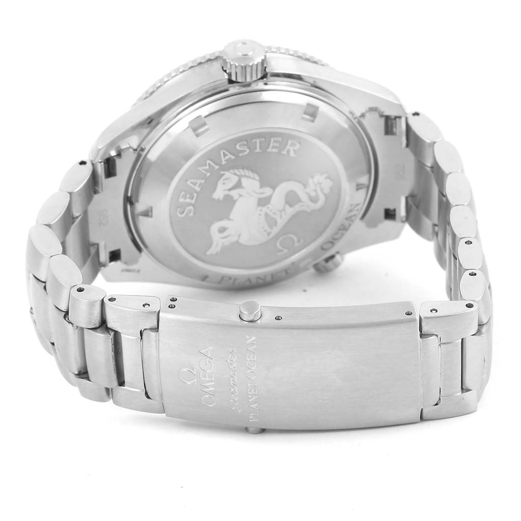 The image shows the back and bracelet clasp of the Omega Seamaster Planet Ocean model, highlighting the case back engraving.