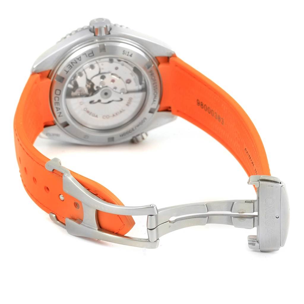 The image shows the back view of the Omega Planet Ocean 232.32.46.21.01.001 Men
s Stainless Steel Black Dial 232.32.46.21.01.001 Men
s Stainless Steel Black Dial watch, highlighting the case back, movement, and orange strap with a clasp.