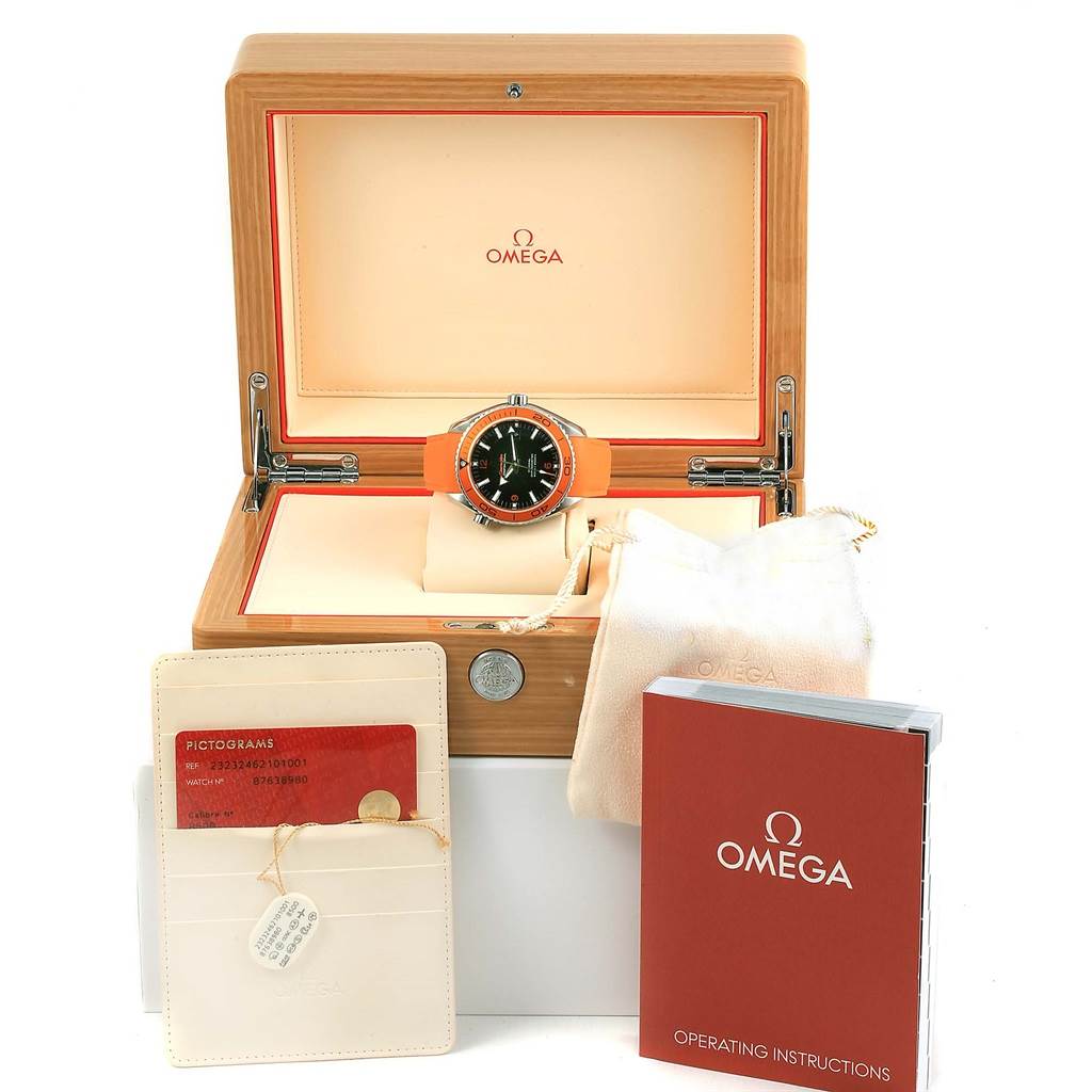 The Omega Planet Ocean 232.32.46.21.01.001 Men
s Stainless Steel Black Dial 232.32.46.21.01.001 Men
s Stainless Steel Black Dial watch is displayed front-on, accompanied by its box, warranty card, manual, and a storage pouch.