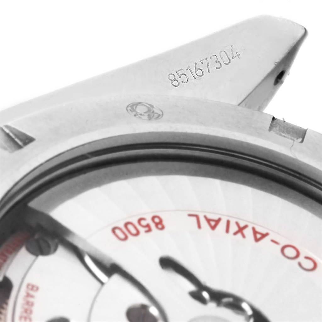 This image shows a close-up of the Omega Planet Ocean 232.30.46.21.01.002 Men's Stainless Steel Black Dial 232.30.46.21.01.002 Men's Stainless Steel Black Dial watch's lug and part of the Co-Axial 8500 movement.