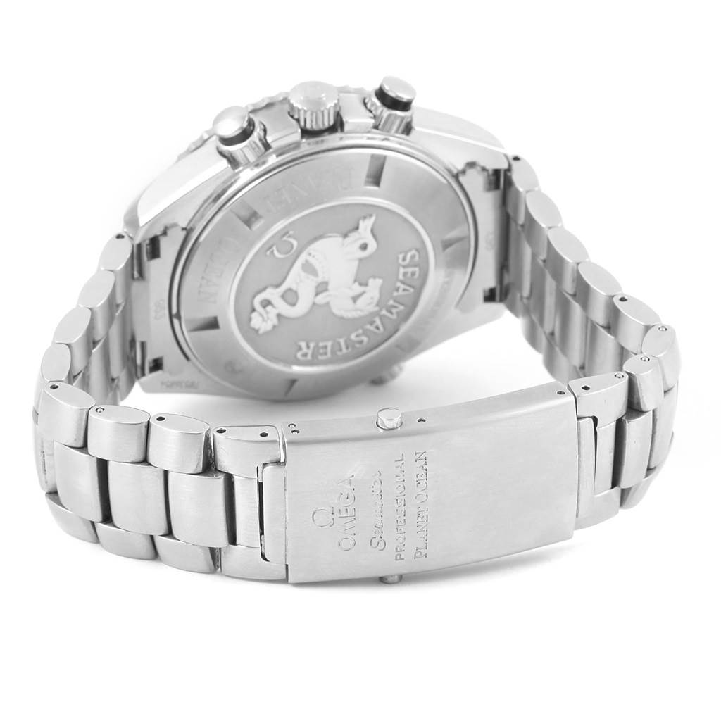 The image shows the back and clasp of the Omega Planet Ocean 2210.50.00 Men
s Stainless Steel Black Dial 2210.50.00 Men
s Stainless Steel Black Dial watch, highlighting the engraved case back and metal bracelet.