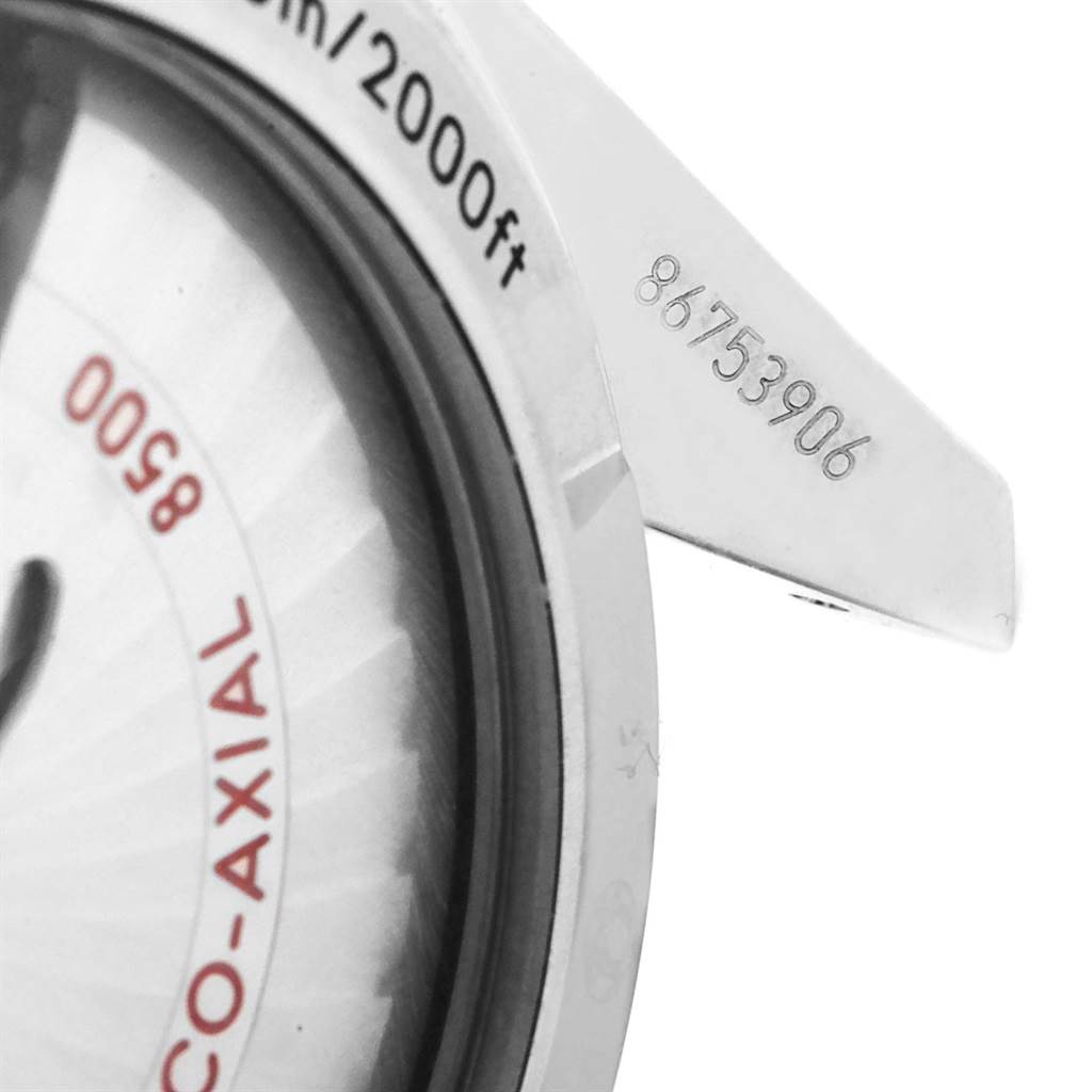 The image shows a close-up of the back of an Omega Planet Ocean 232.30.42.21.01.001 Men
s Stainless Steel Black Dial 232.30.42.21.01.001 Men
s Stainless Steel Black Dial watch, highlighting the serial number and water depth rating.